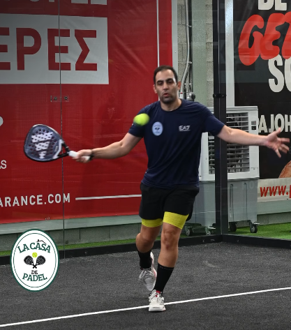 Stefanos Kouvaris, owner of La Casa de Padel Cyprus, playing padel during a match on the club's indoor courts.